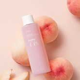 It is a hydrating and brightening toner formulated with 77% peach extract and niacinamide to revitalize and balance the skin.