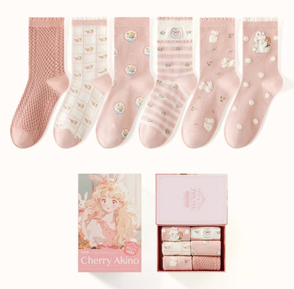 The Cherry Akino Series by Caramella offers a delightful collection of six pairs of socks in charming pink tones. 